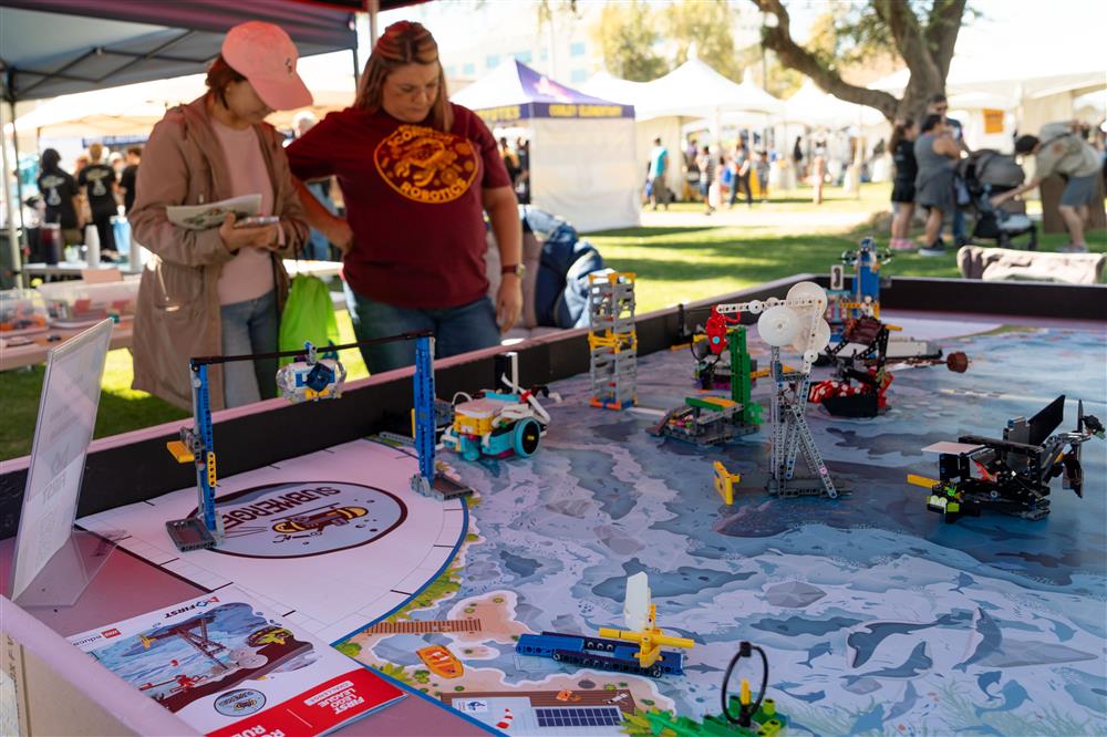 An image of people at the Chandler Innovation Fair at their booth.